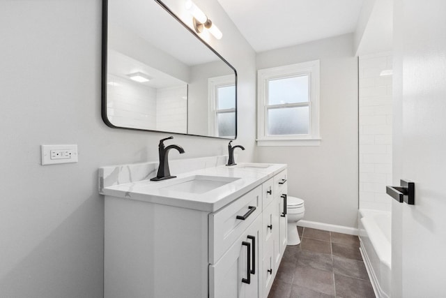 full bathroom with vanity, bathtub / shower combination, and toilet