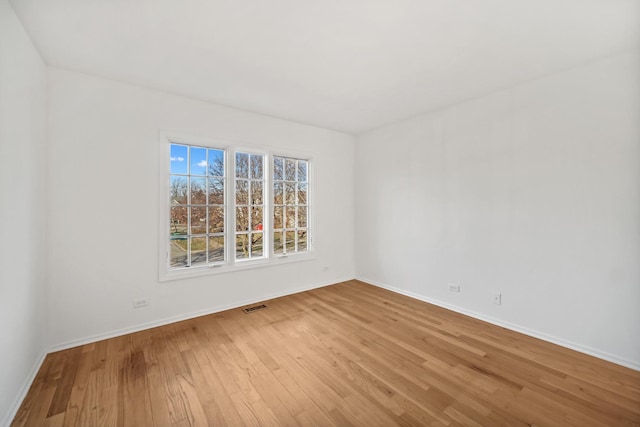 spare room featuring hardwood / wood-style floors