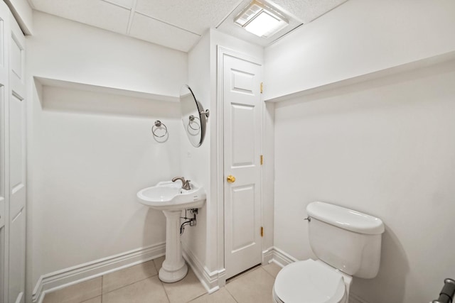 bathroom featuring tile patterned flooring and toilet