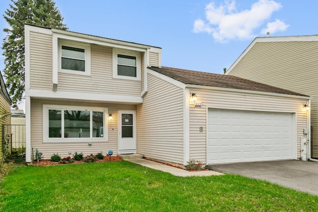 view of front of house featuring a front yard and a garage