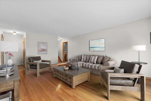 living room with light hardwood / wood-style flooring