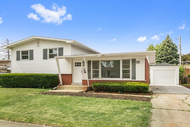 tri-level home featuring an outbuilding, a front lawn, and a garage