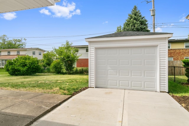 garage featuring a yard