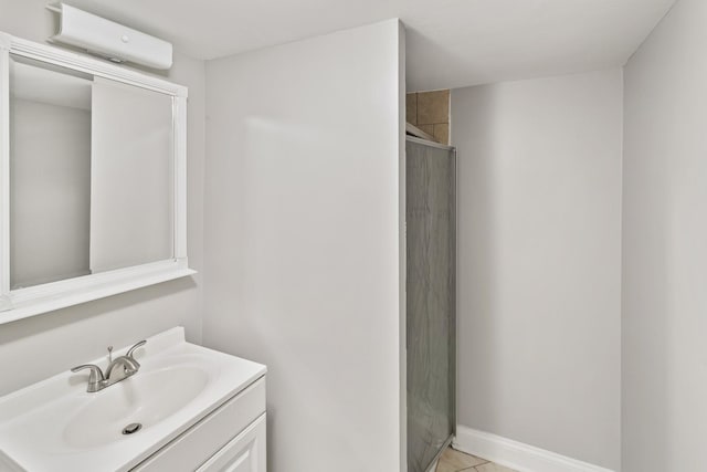 bathroom with vanity, tile patterned floors, walk in shower, and a wall unit AC