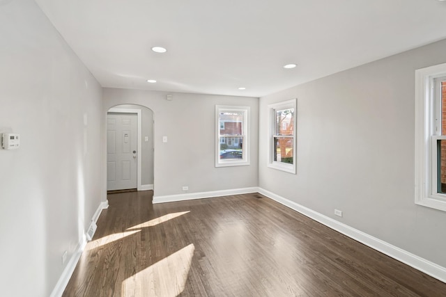 spare room with dark hardwood / wood-style floors