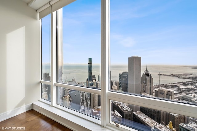 interior details featuring a water view and hardwood / wood-style flooring