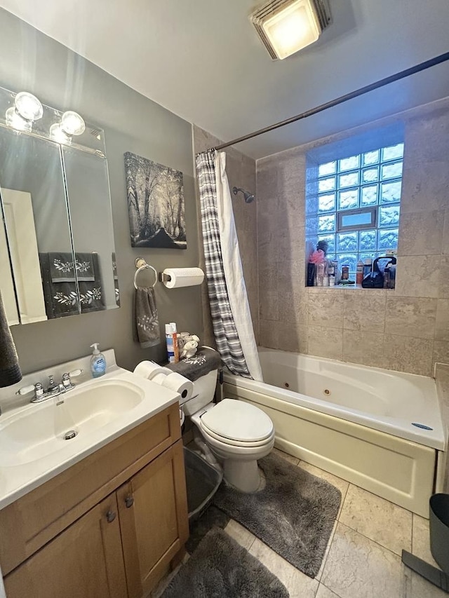 full bathroom with tile patterned flooring, shower / tub combo with curtain, vanity, and toilet