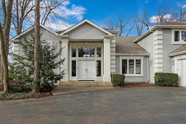 property entrance with a garage