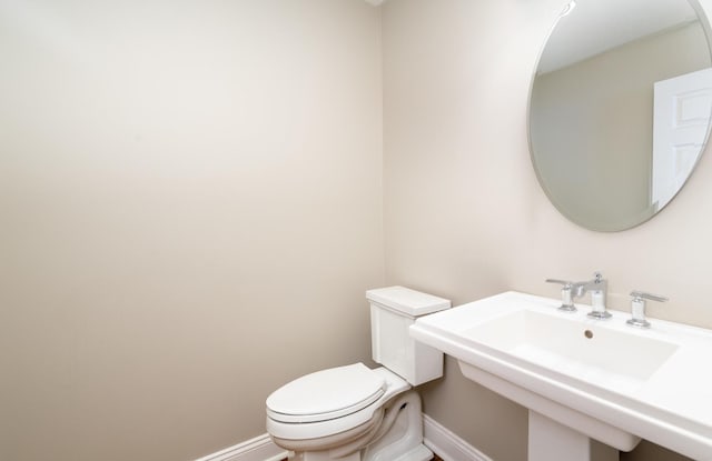 bathroom with toilet and sink