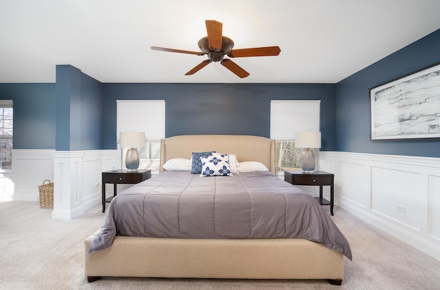 bedroom featuring ceiling fan and light colored carpet