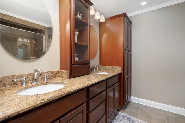 bathroom with tile patterned flooring, vanity, a shower with shower door, and crown molding