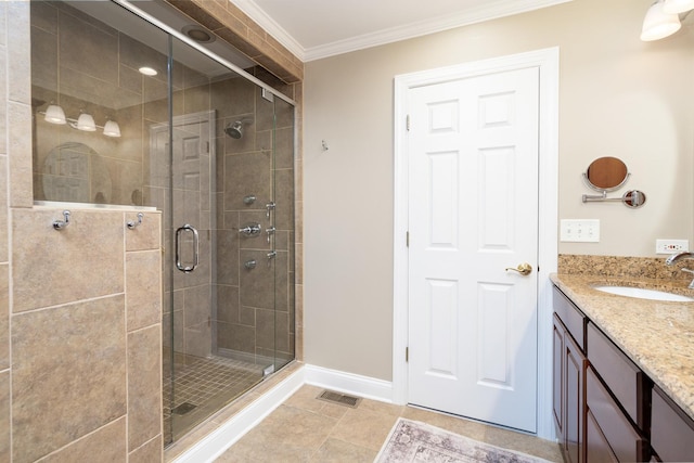 bathroom featuring vanity, an enclosed shower, and ornamental molding