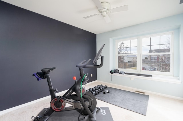 exercise room with ceiling fan and carpet floors