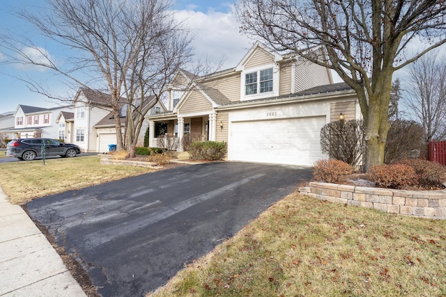 view of front facade featuring a garage and a front yard