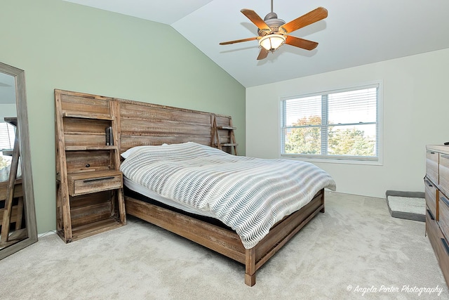 carpeted bedroom featuring ceiling fan and lofted ceiling