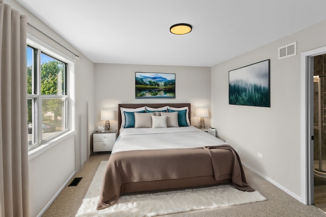 bedroom featuring light colored carpet