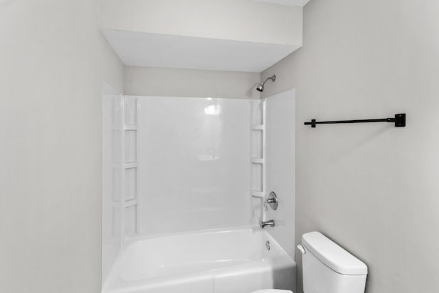 bathroom with shower / bath combination and toilet