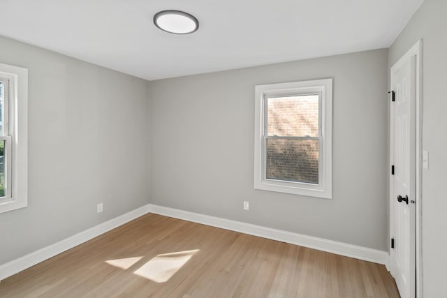 spare room with light hardwood / wood-style floors