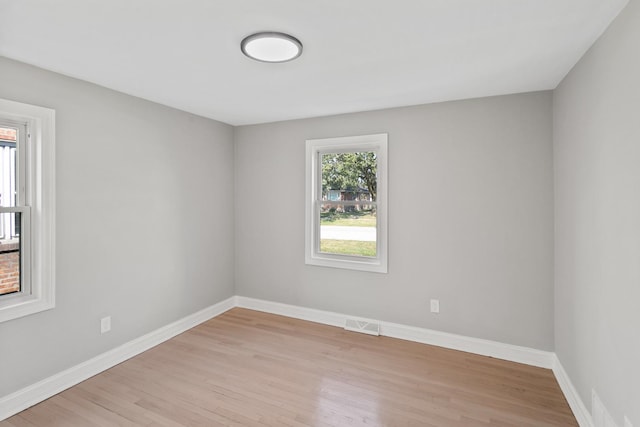 unfurnished room featuring light wood-type flooring