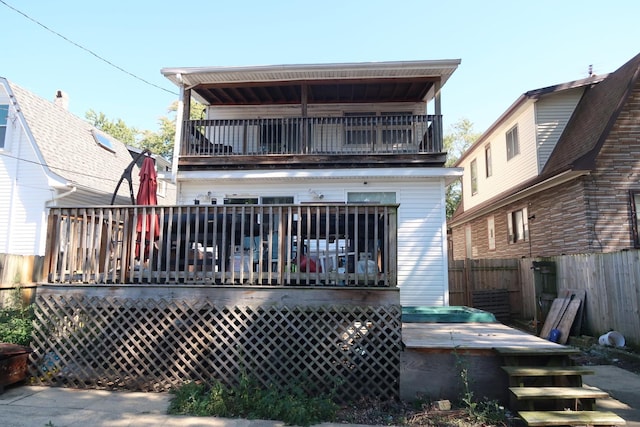 rear view of house with a balcony