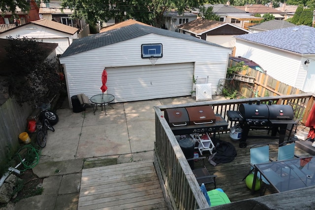 view of patio / terrace featuring a grill, an outdoor structure, and a garage