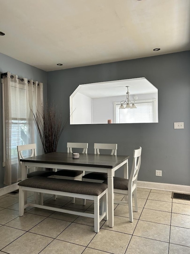 dining room featuring light tile patterned floors