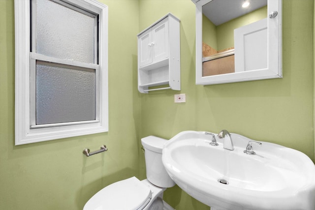 bathroom featuring toilet and sink