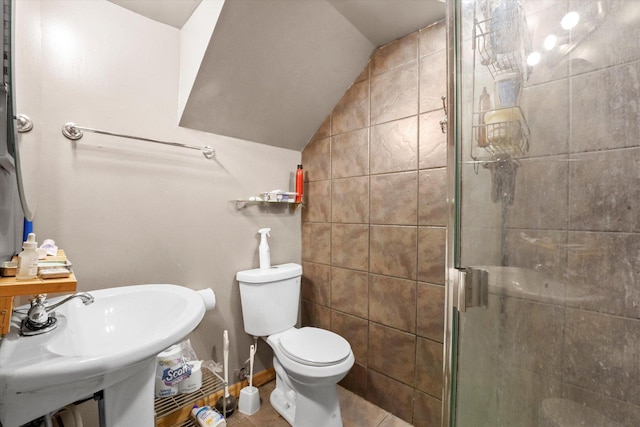 bathroom with sink, tile patterned flooring, an enclosed shower, vaulted ceiling, and toilet