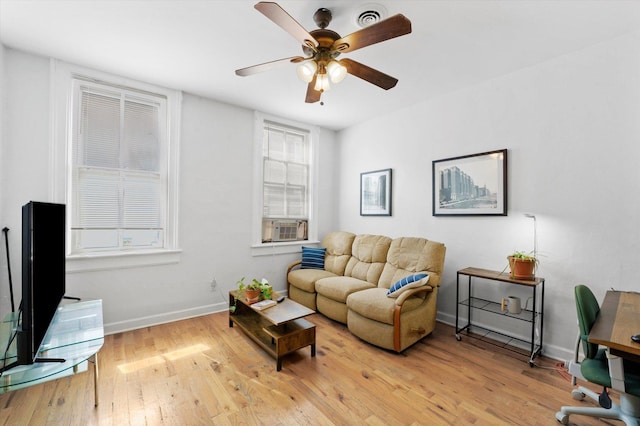 living room featuring ceiling fan and light hardwood / wood-style floors