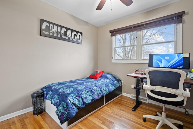 bedroom with ceiling fan and wood-type flooring