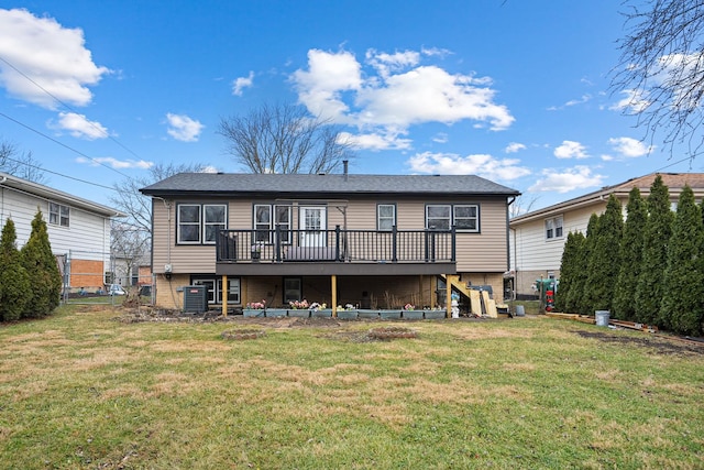 back of house with a lawn, a wooden deck, and central air condition unit