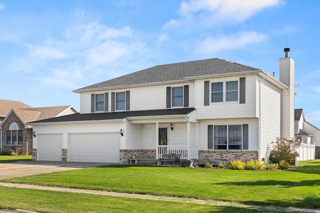 view of front of house with a front lawn, covered porch, and a garage