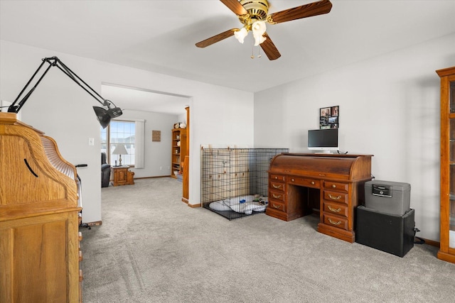 carpeted office with ceiling fan