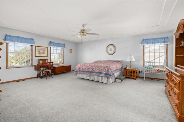 bedroom with ceiling fan and light colored carpet