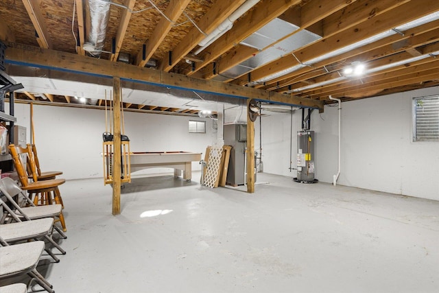 basement with pool table and water heater