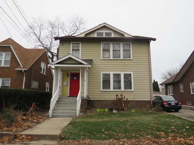 front facade with a front yard