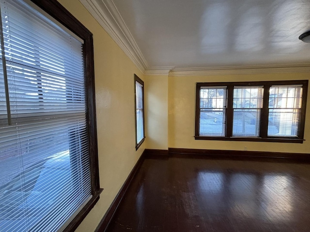 unfurnished room with dark hardwood / wood-style flooring and crown molding