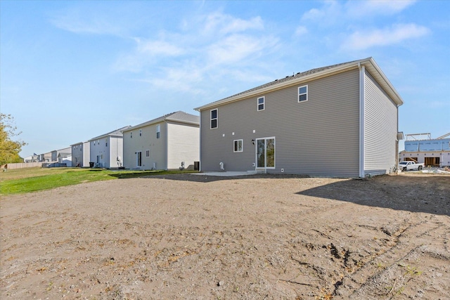 back of house with a patio