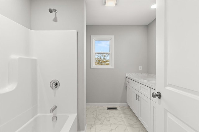 bathroom featuring bathtub / shower combination and vanity