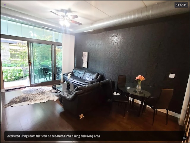 living room with ceiling fan and wood-type flooring