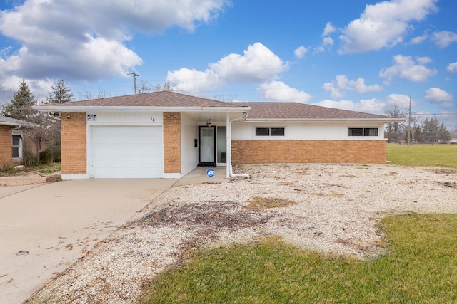 single story home with a front yard and a garage