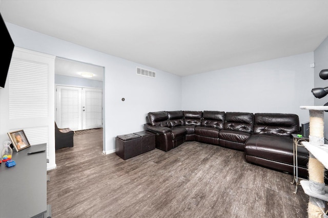 living room with dark hardwood / wood-style flooring