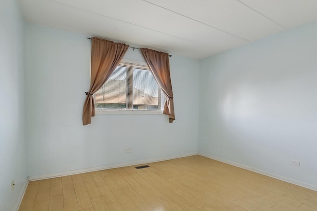 unfurnished room featuring light hardwood / wood-style floors