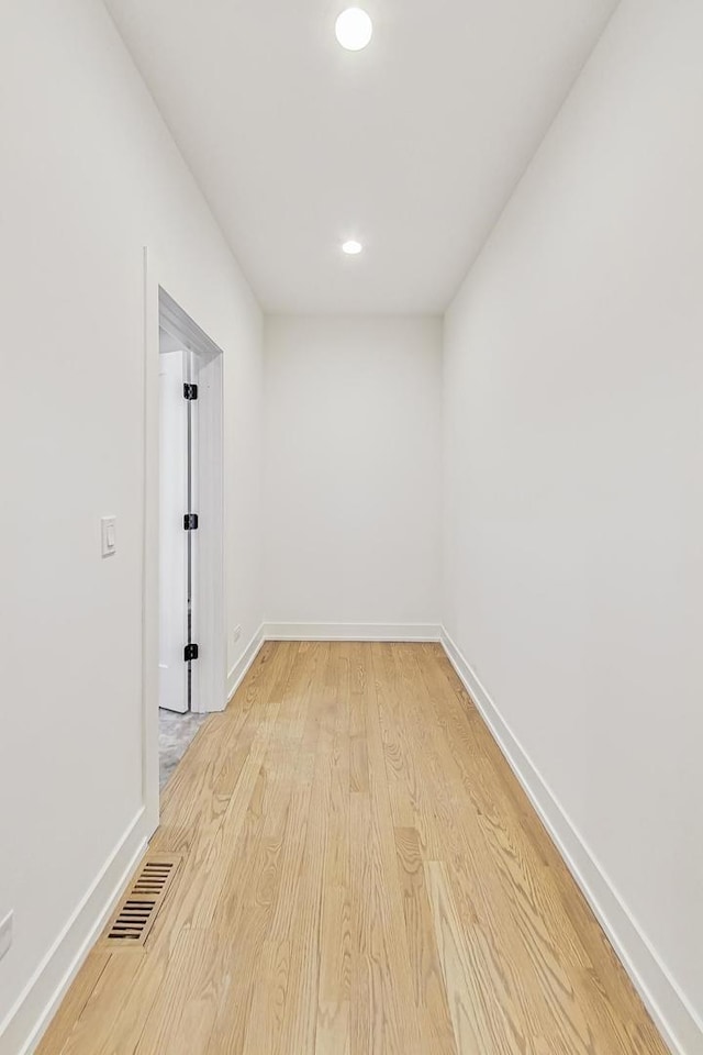 spare room with light hardwood / wood-style flooring