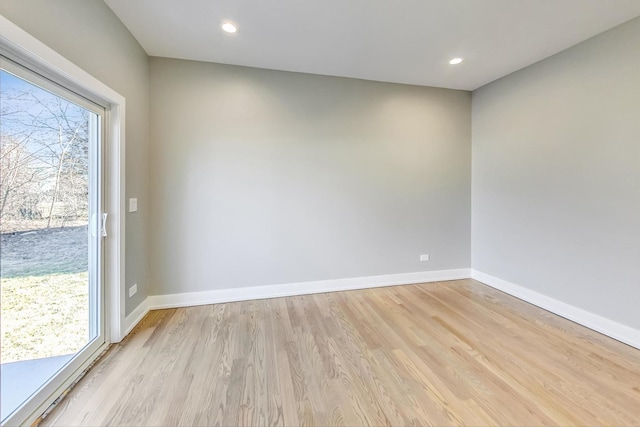 empty room with light hardwood / wood-style floors