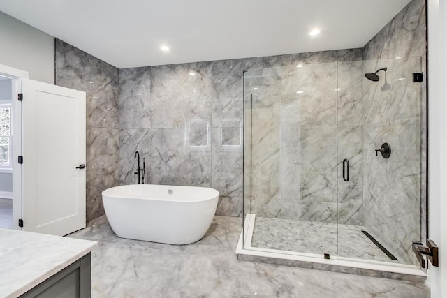 bathroom featuring independent shower and bath and vanity