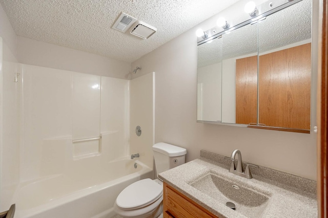 full bathroom featuring vanity, shower / bathing tub combination, a textured ceiling, and toilet