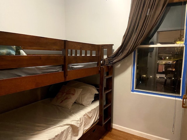 bedroom with wood-type flooring