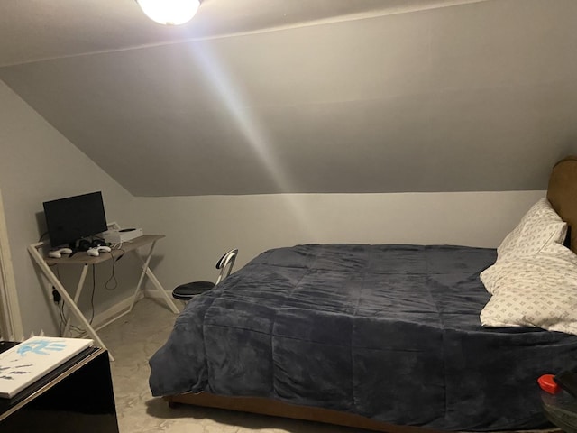 bedroom featuring vaulted ceiling