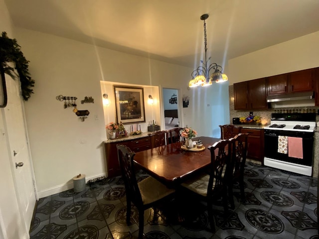 dining space featuring a notable chandelier